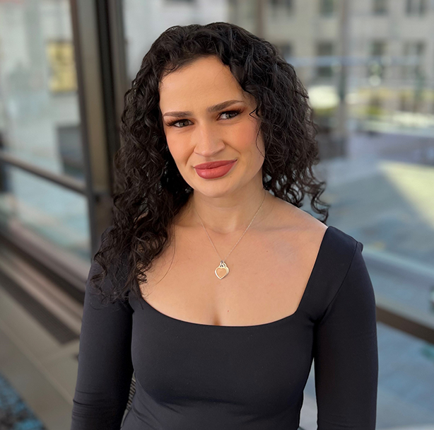 Belma Pehratović, a Travelers employee, featured in a professional headshot, representing inclusion and professional development at Travelers.