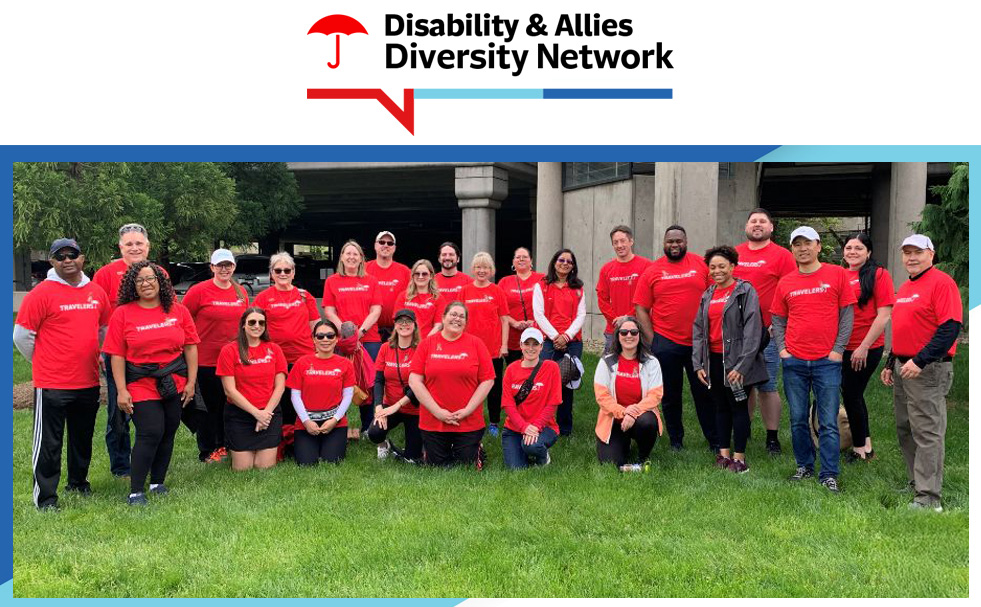 Disability & Allies Diversity Network. Group of employees in red Travelers shirts posing outdoors.