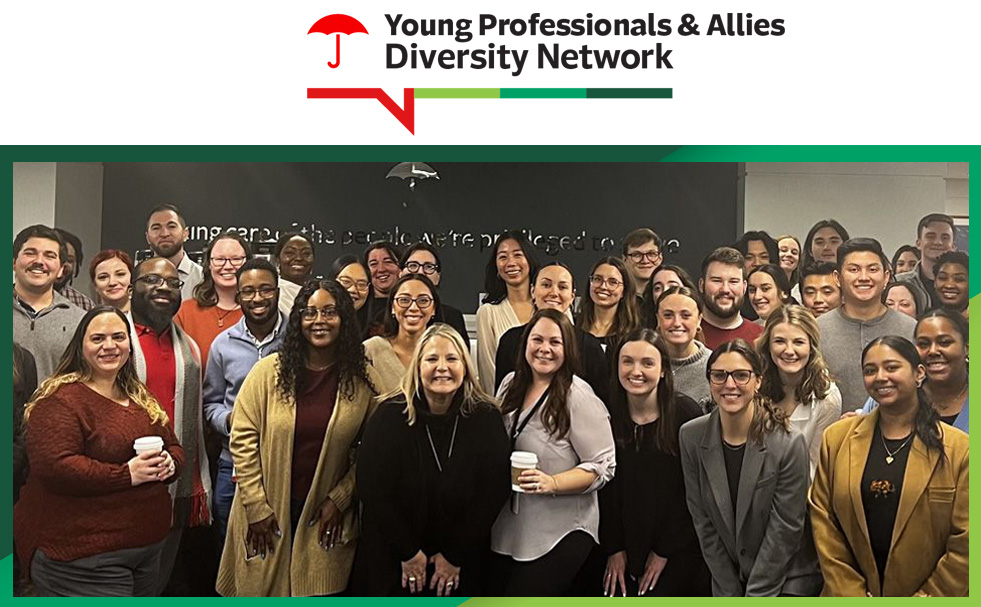 Young Professionals & Allies Diversity Network. Large group of professionals gathered at a workplace event.