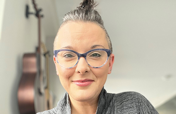 Joelle Rees, a Travelers employee, featured in a professional headshot, representing leadership and expertise at Travelers.