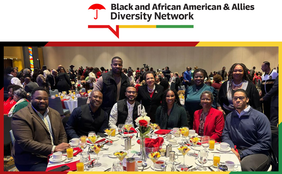 Black and African American & Allies Diversity Network. Group of colleagues smiling at a formal diversity event.
