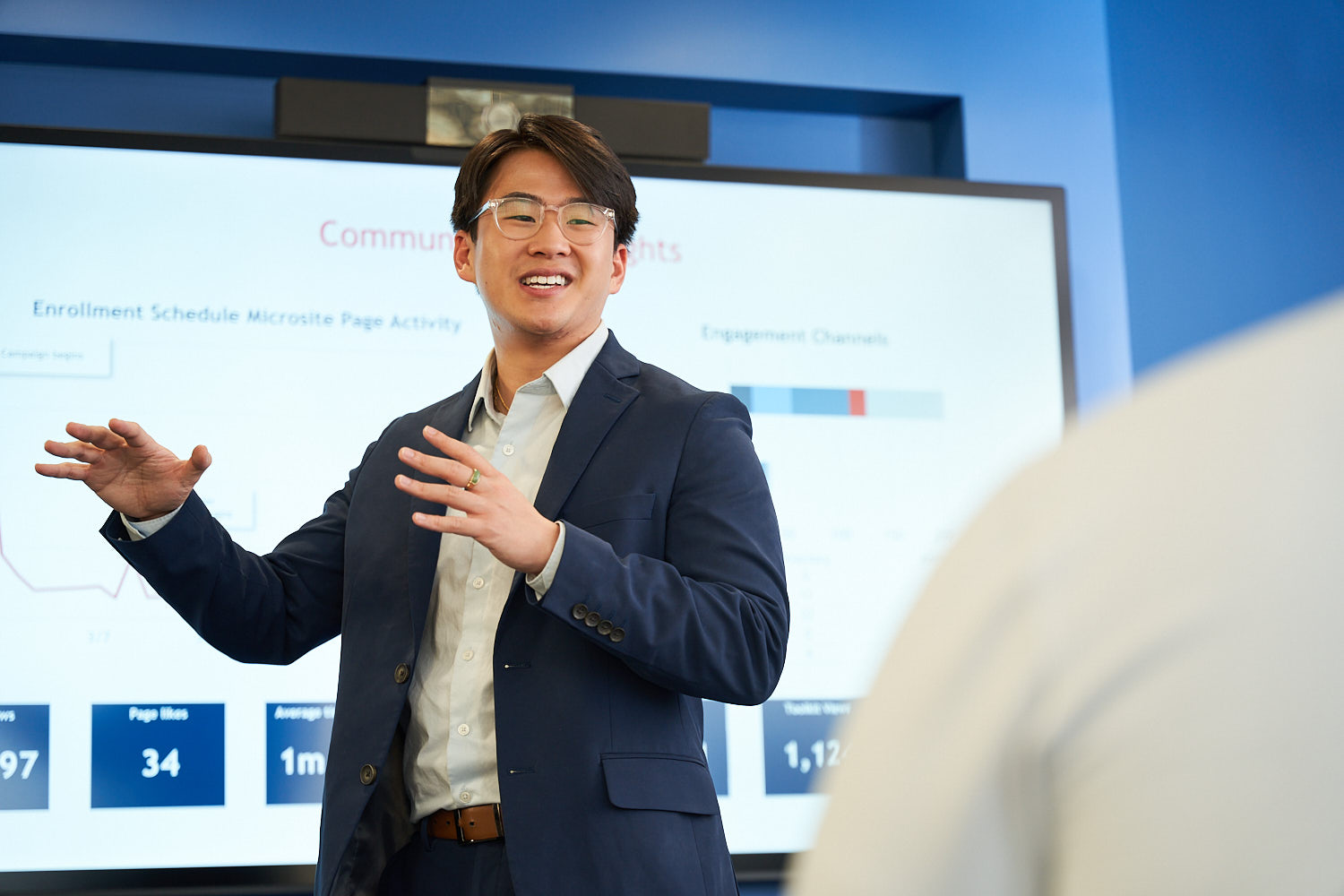 Man presenting data insights during a business meeting.