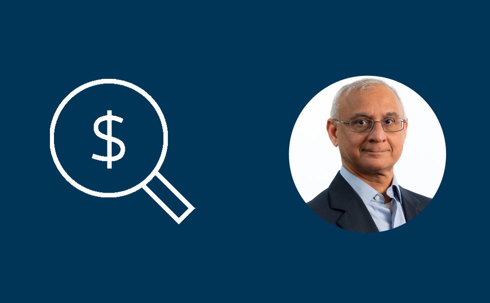 A dark blue background with two circular elements - on the left, a white magnifying glass icon with a dollar sign symbol inside the lens, and on the right, a professional headshot of a middle-aged man with glasses, gray hair, wearing a dark suit jacket and light blue shirt, smiling at the camera.